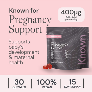 Pregnancy support supplement packaging with text on a pink background
